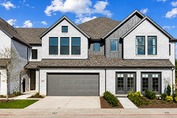 Modern Brick House With Large Windows And Double Garage